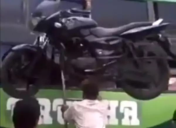Man Carries Motorbike On His Head While Climbing A Ladder [SEE PHOTO]